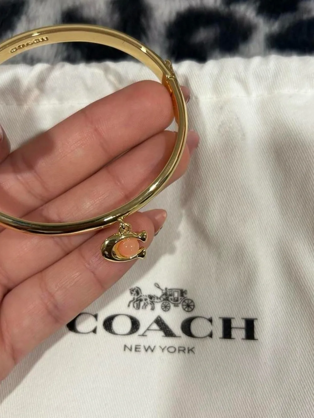 Coach Gold Bangle Bracelet with Coral Charm